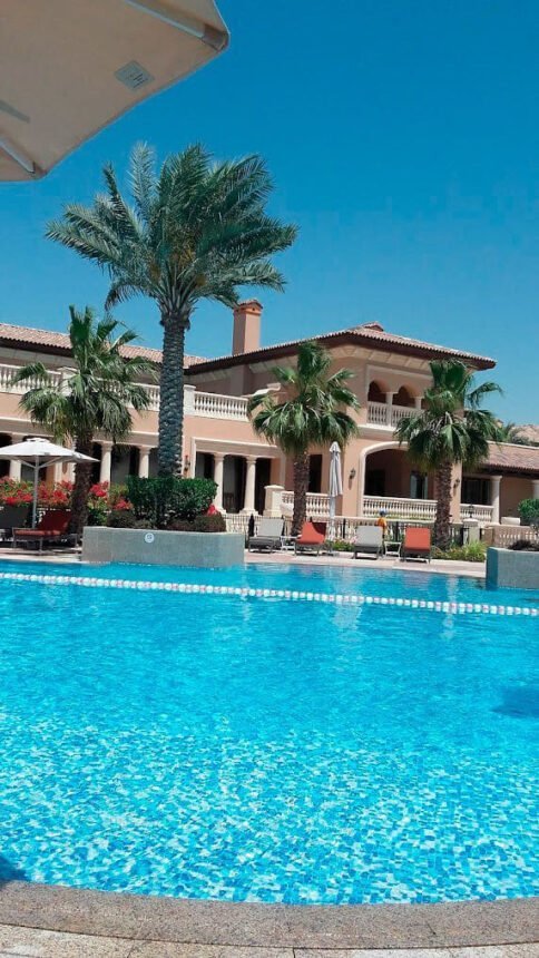 Swimming pools and landscaped gardens at each villa